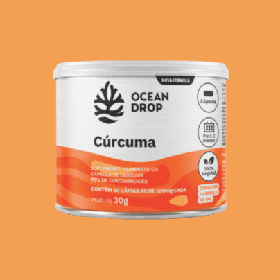 Suplemento Cúrcuma Ocean Drop 500mg com 95% de curcuminoides em embalagem de 60 cápsulas, fundo laranja destacado.